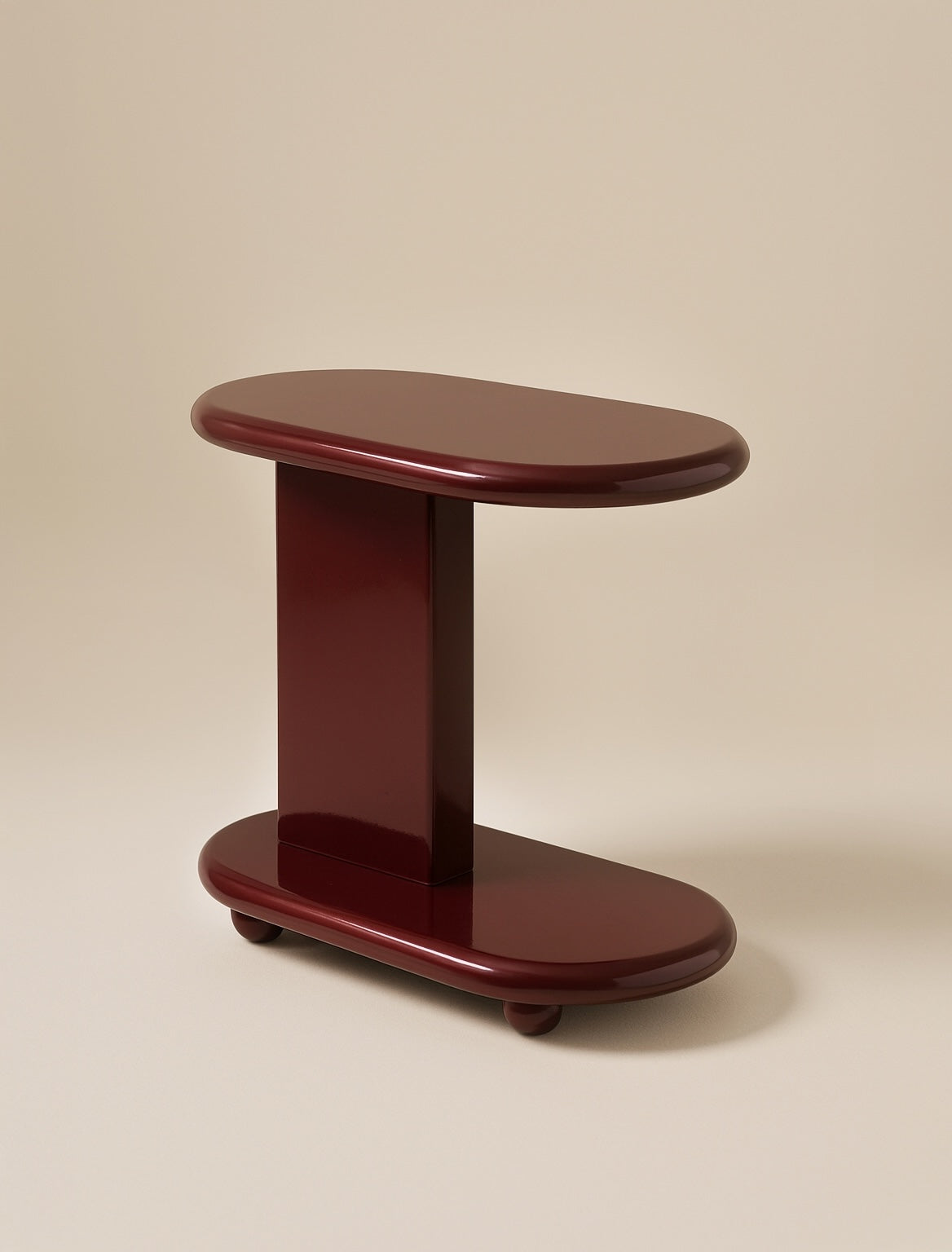 Wooden side table finished in high gloss lacquer.